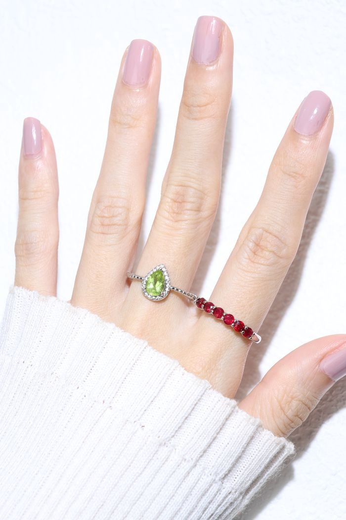 Peridot Teardrop Halo Ring in Rose Gold worn on the hand