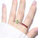 Peridot Teardrop Halo Ring in Rose Gold worn on the hand