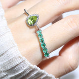 Peridot Teardrop Halo Ring in Silver worn close-up