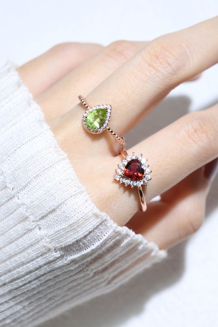 Peridot Teardrop Halo Ring in Silver worn on the hand