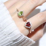 Peridot Teardrop Halo Ring in Silver worn on the hand