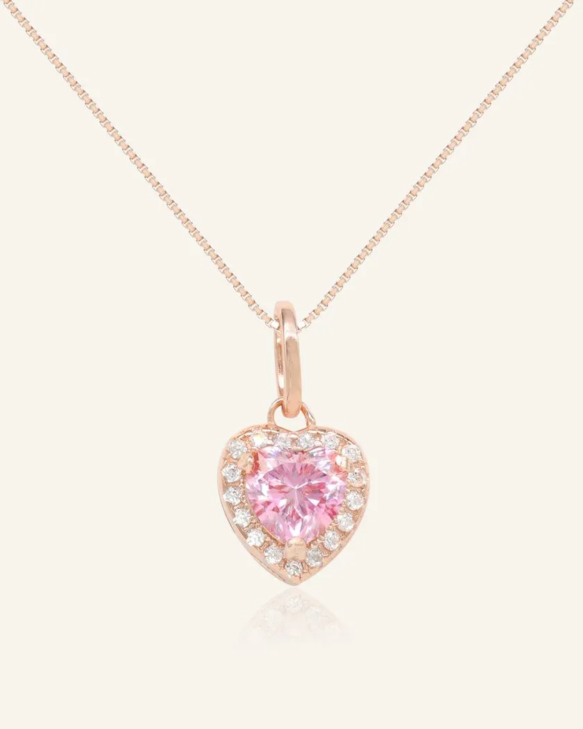 heart-shaped pink moissanite halo necklace in rose gold vermeil, featuring a vibrant pink moissanite centerpiece surrounded by a halo of sparkling cubic zirconias.