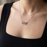 Prism Baguette Rainbow Sapphire Necklace in silver with six multicolour natural sapphires worn at the collarbone