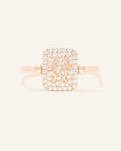 Close-up of the Reversible Mahjong Citrine Ring, resting on a warm linen background