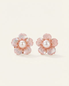 Sakura Studs | Pearl & Mother of Pearl, resting on a warm linen background