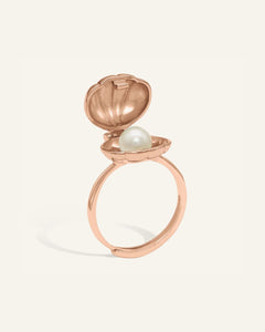 Seashell Pearl Ring | Interactive, resting on a warm linen background
