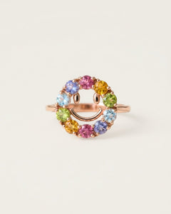 Smiley Ring | Semi-Precious Gems, resting on a warm linen background