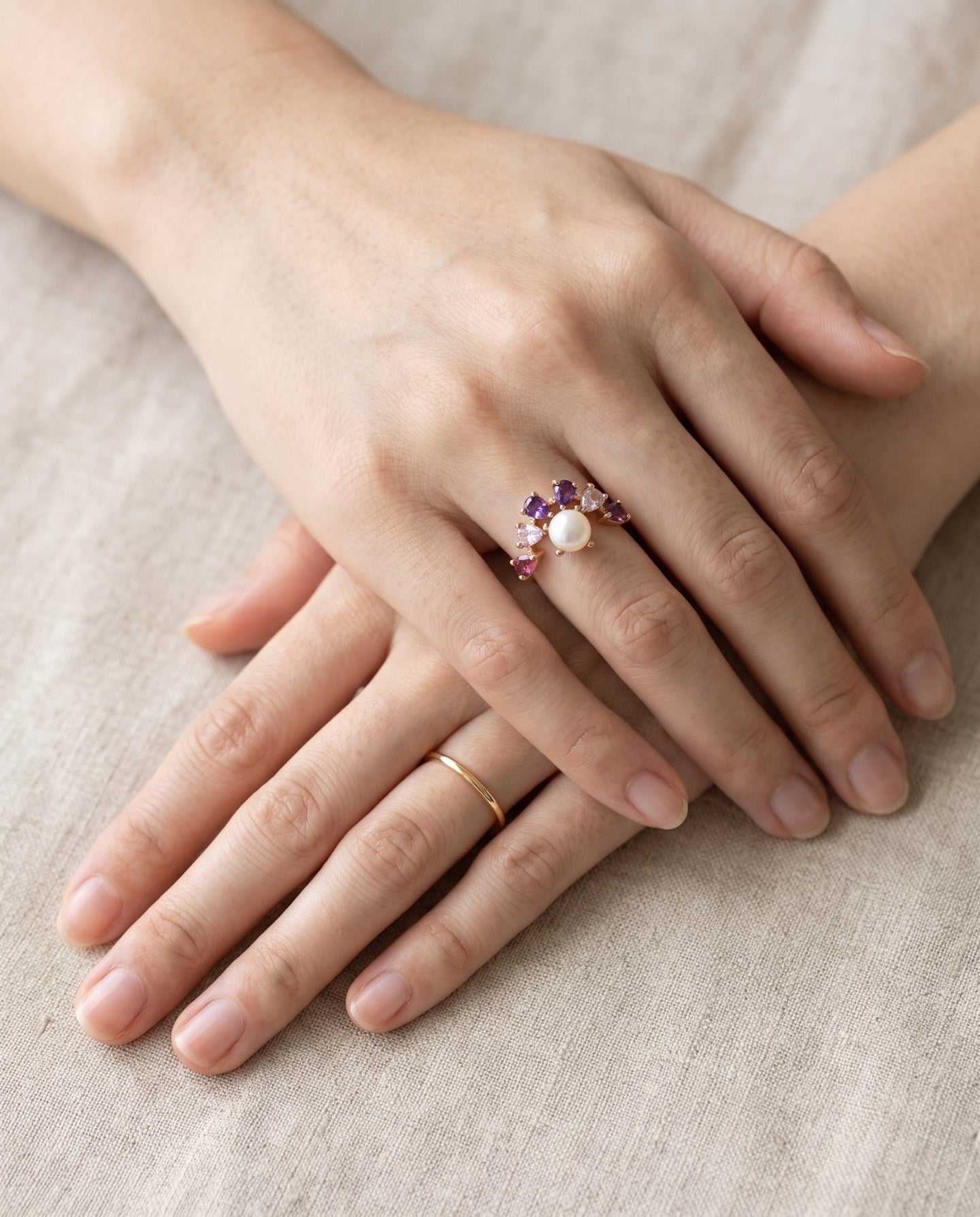 Solstice Pearl & Gemstone Ring with freshwater pearl, amethyst, rhodolite garnet and rose quartz, rose gold worn hands