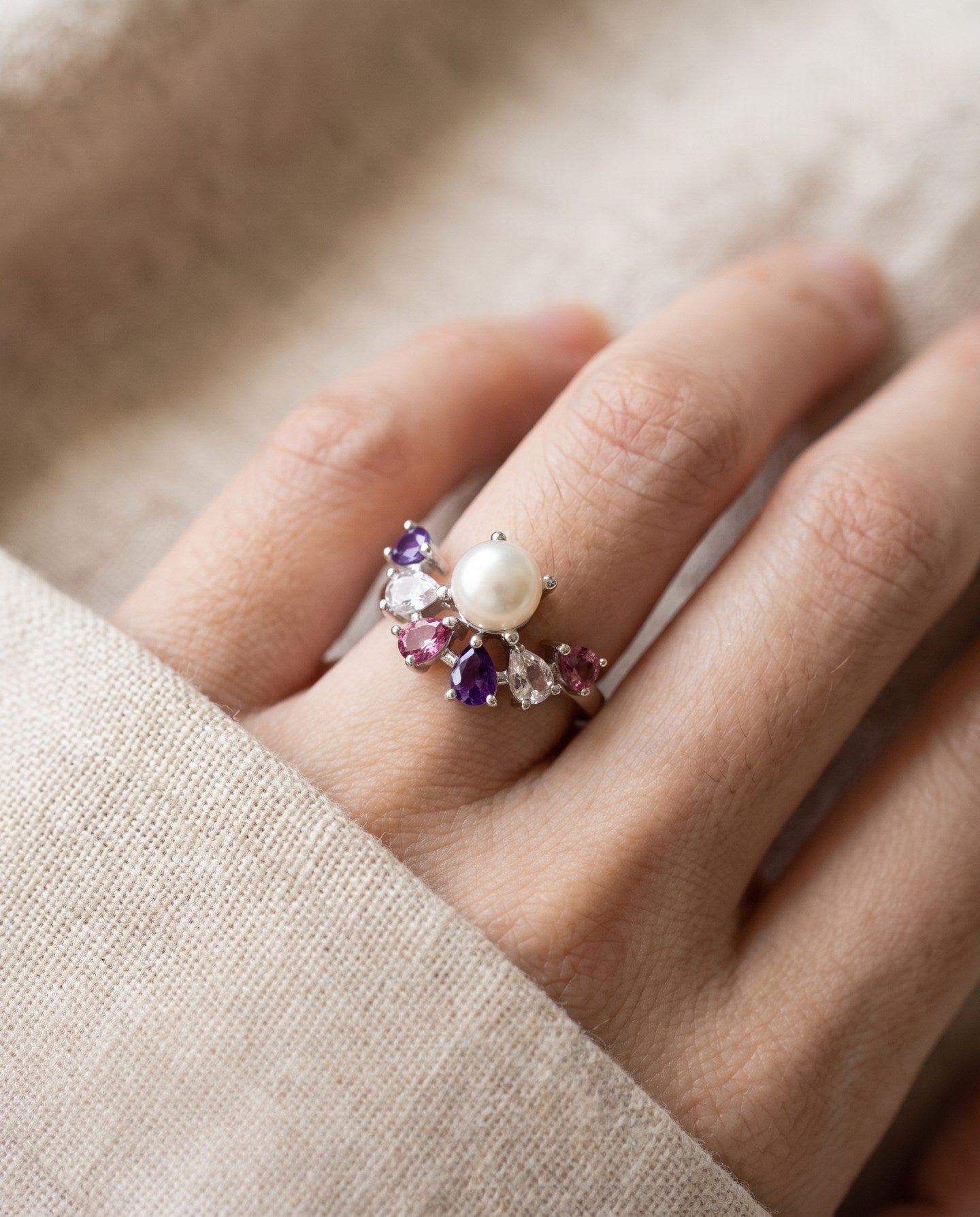 Solstice Pearl & Gemstone Ring with freshwater pearl, amethyst, rhodolite garnet and rose quartz, silver worn closeup