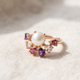 Solstice Pearl & Gemstone Ring in yellow gold on ivory linen, with freshwater pearl and seven pear-cut natural gemstones