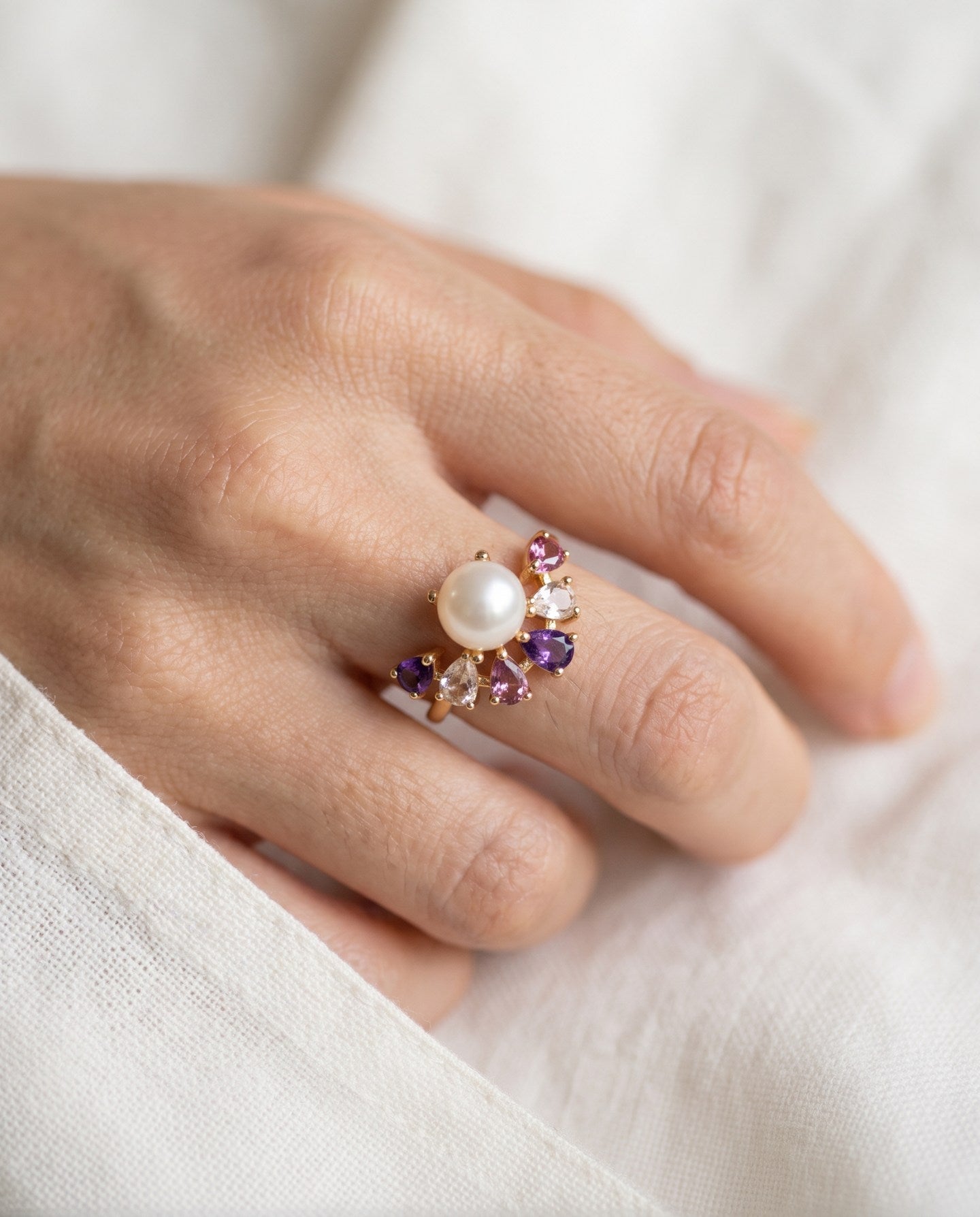 Solstice Pearl & Gemstone Ring with freshwater pearl, amethyst, rhodolite garnet and rose quartz, yellow gold worn