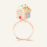 Spinning Gingerbread House Ring in rose gold, front view of the gingerbread house with candy-cane door and blue window