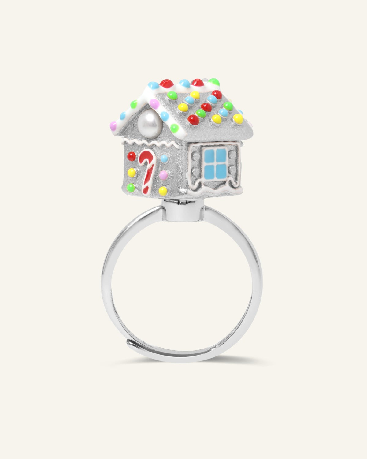 Spinning Gingerbread House Ring in silver, angled view of the candy-decorated gingerbread house
