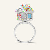Spinning Gingerbread House Ring in silver, angled view of the candy-decorated gingerbread house