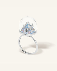 Spinning Magical Kingdom Ring | Blue Snow, resting on a warm linen background