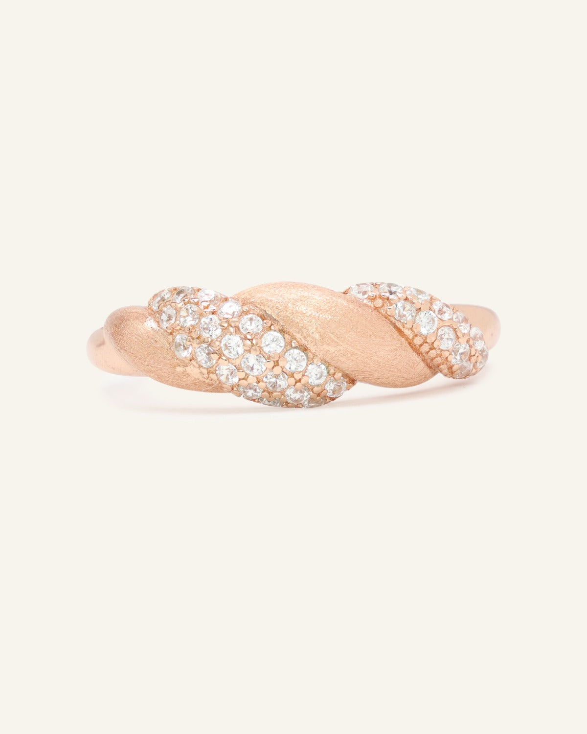 Sugar Sprinkled Croissant Ring in rose gold, front view of the pavé croissant band on warm ivory