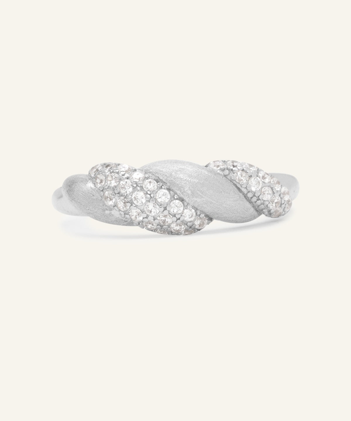 Sugar Sprinkled Croissant Ring in silver, front view of the pavé croissant band on warm ivory