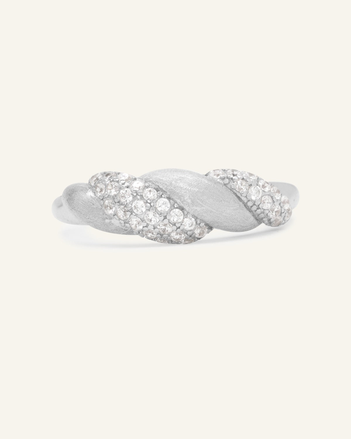 Sugar Sprinkled Croissant Ring in silver, front view of the pavé croissant band on warm ivory