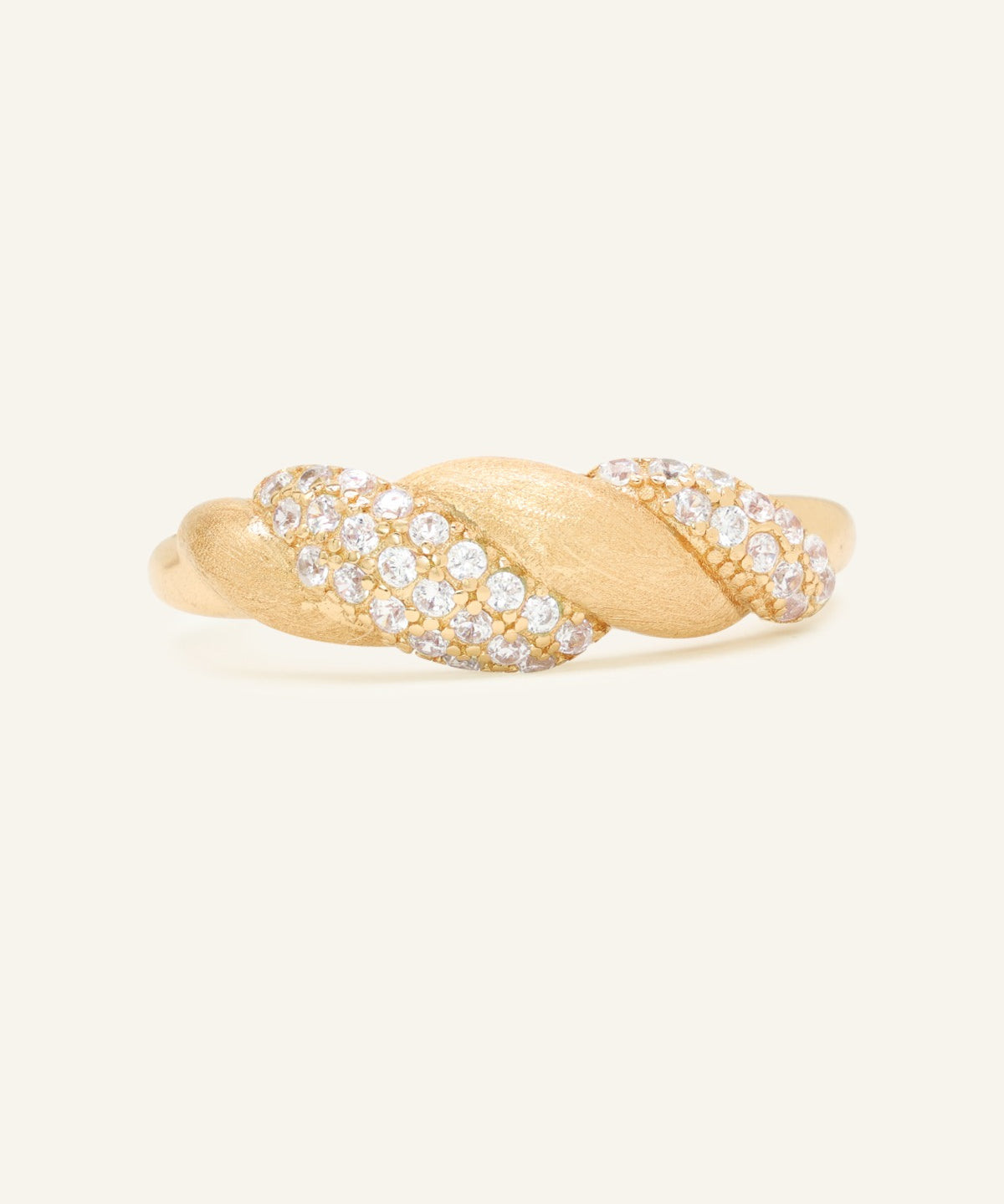 Sugar Sprinkled Croissant Ring in yellow gold, front view of the pavé croissant band on warm ivory