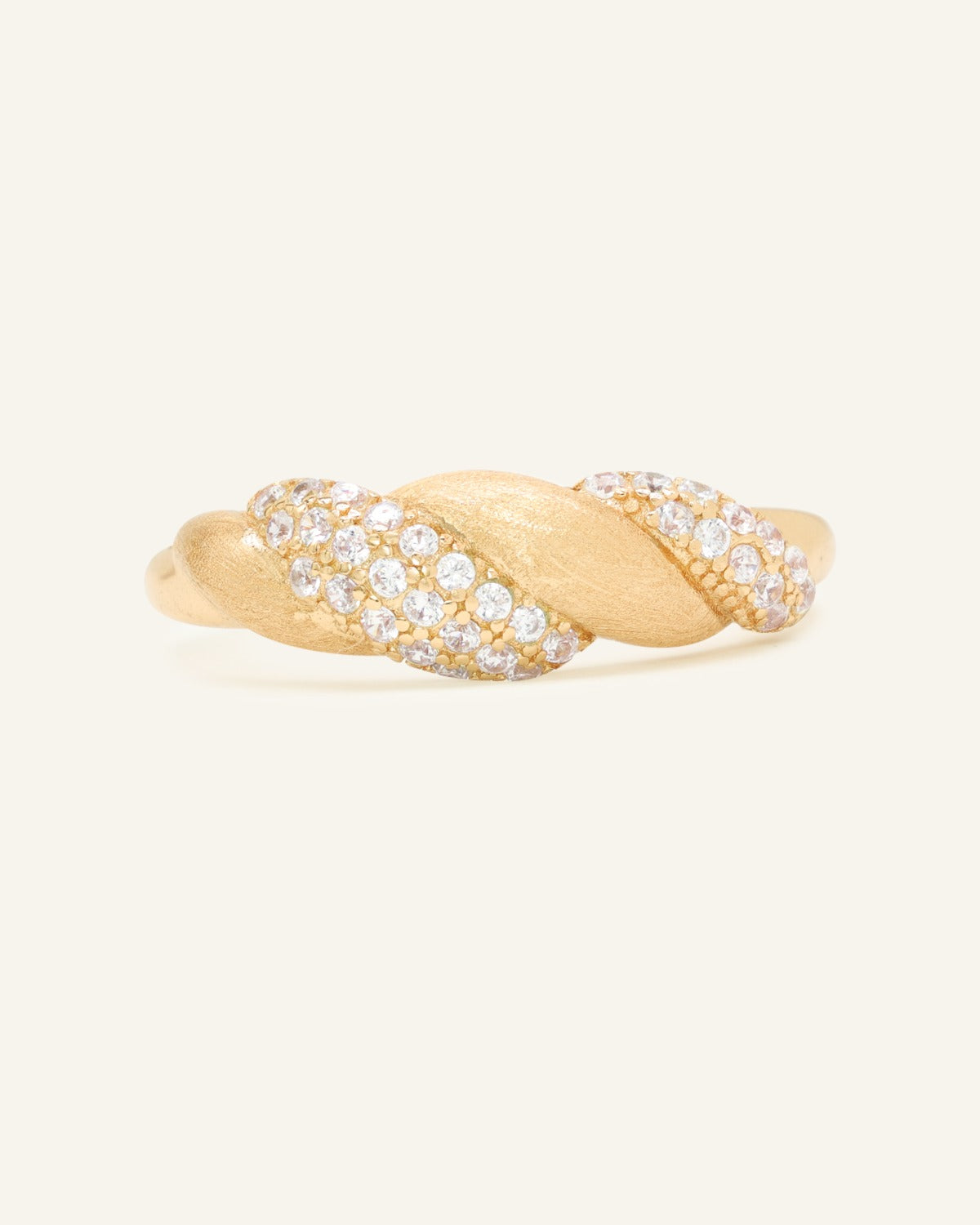 Sugar Sprinkled Croissant Ring in yellow gold, front view of the pavé croissant band on warm ivory