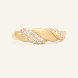 Sugar Sprinkled Croissant Ring in yellow gold, front view of the pavé croissant band on warm ivory