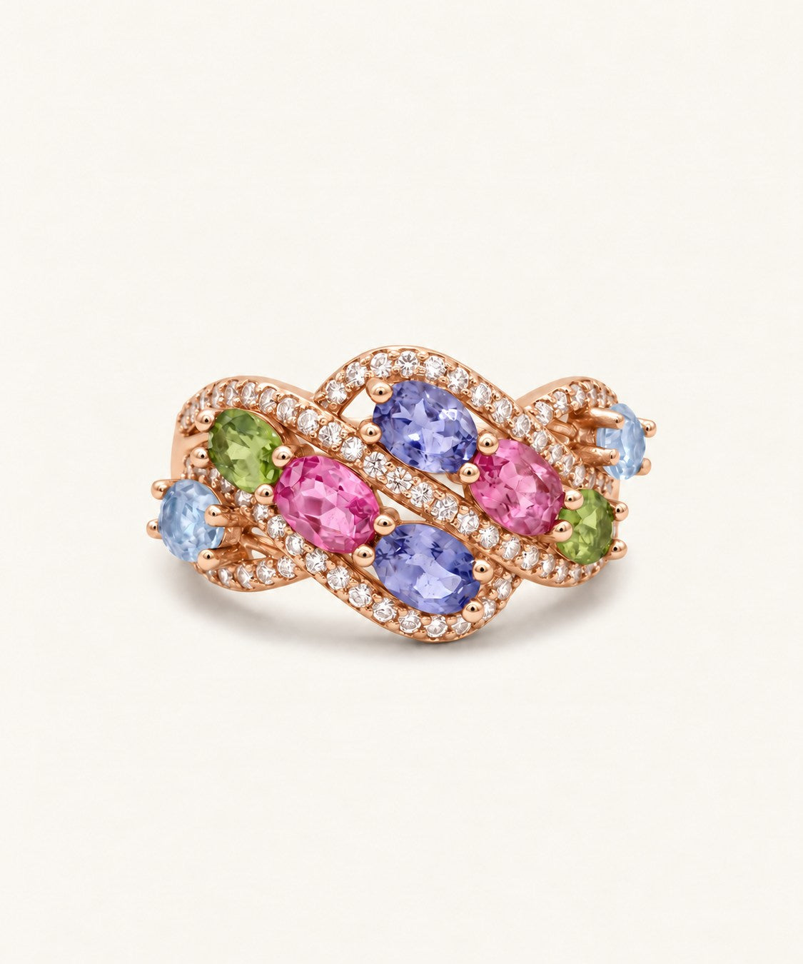 Symphony Wave Multi-Gemstone Ring in rose gold, on warm ivory with intertwined ribbons and colourful oval gemstones