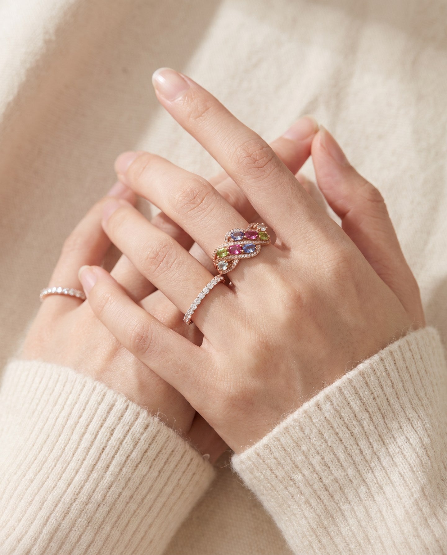 Symphony Wave Multi-Gemstone Ring in rose gold, worn on a hand in natural light