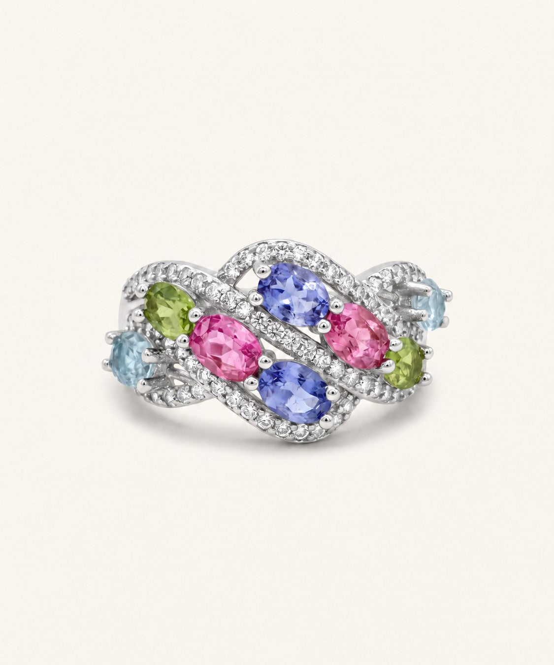 Symphony Wave Multi-Gemstone Ring in silver, on warm ivory with intertwined ribbons and colourful oval gemstones