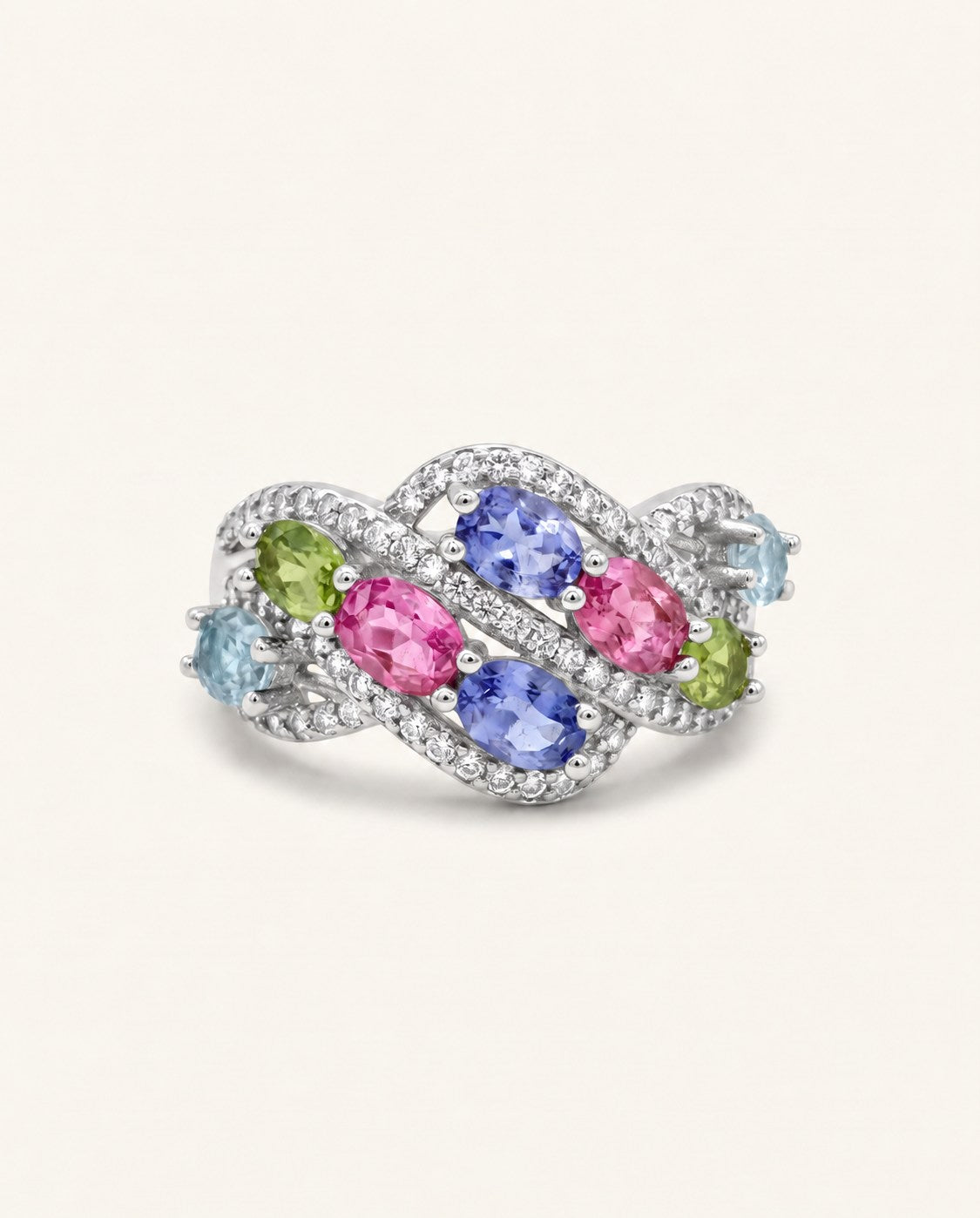 Symphony Wave Multi-Gemstone Ring in silver, on warm ivory with intertwined ribbons and colourful oval gemstones