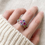 Symphony Wave Multi-Gemstone Ring in silver, worn on a hand in natural light