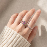 Symphony Wave Multi-Gemstone Ring in silver, worn on a hand in natural light