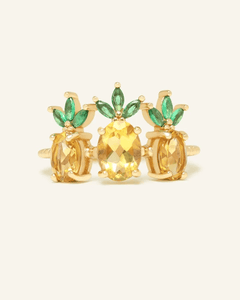 Trilogy Pineapple Citrine Ring, resting on a warm linen background