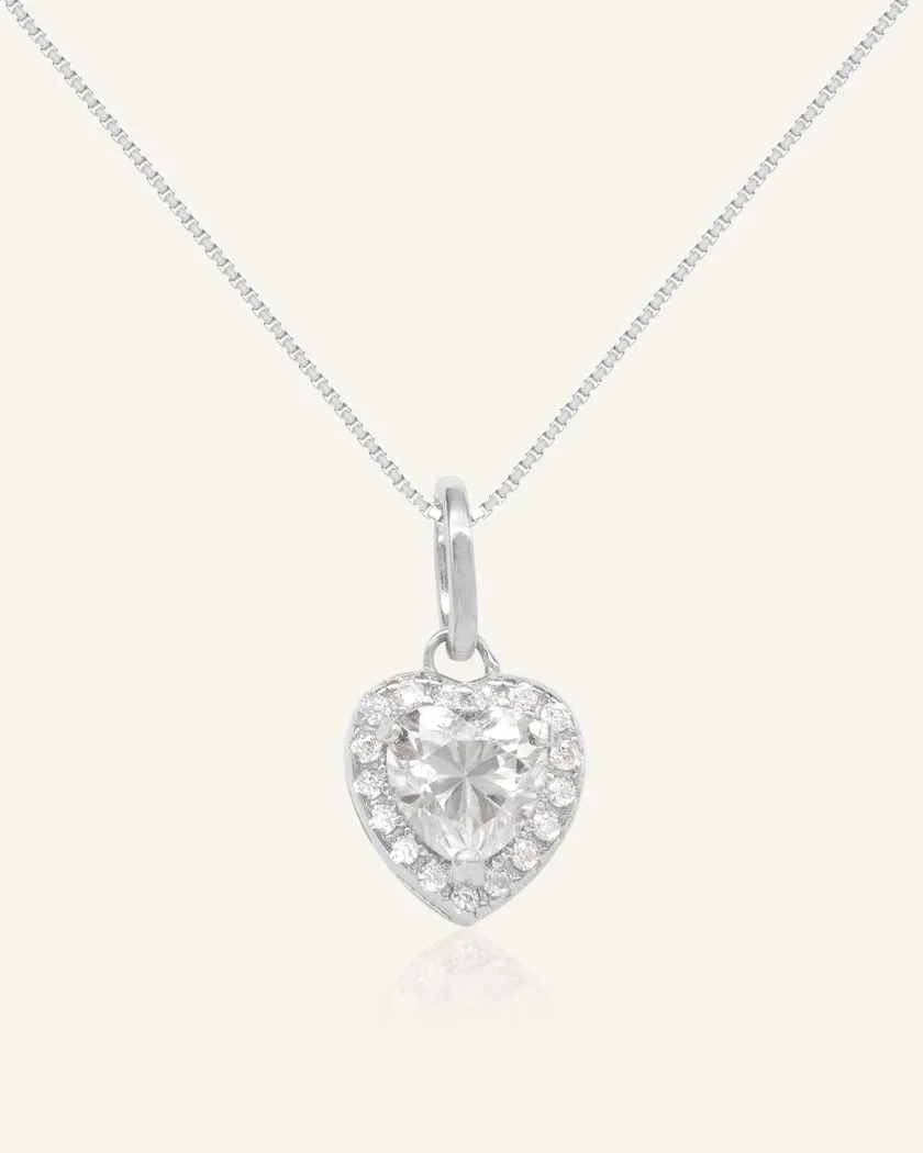 white heart-shaped moissanite halo necklace in rhodium vermeil, featuring a sparkling moissanite centerpiece surrounded by a halo of cubic zirconias, set on a fine rhodium vermeil chain.