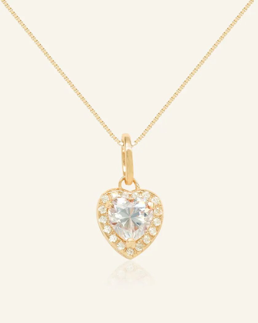 white heart-shaped moissanite halo necklace in yellow gold vermeil, featuring a sparkling moissanite centerpiece surrounded by a halo of cubic zirconias, set on a fine yellow gold vermeil chain.